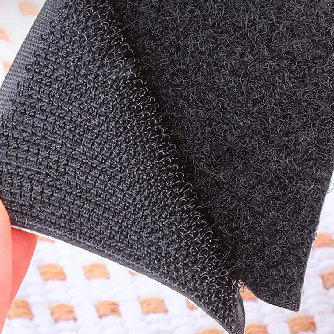 Close-up of black hook & loop fastener backing used on 20th Armoured Brigade TRF patches, showing durable Velcro texture for secure attachment.