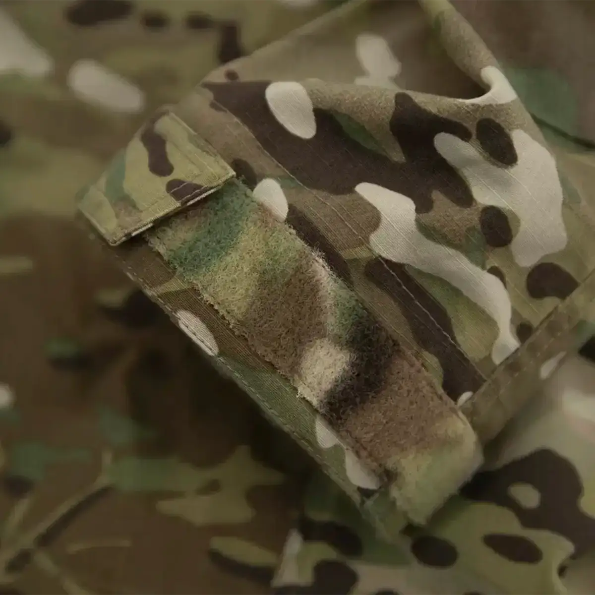 Close-up of camouflage fabric and Velcro patch on military jacket from John Bull Clothing