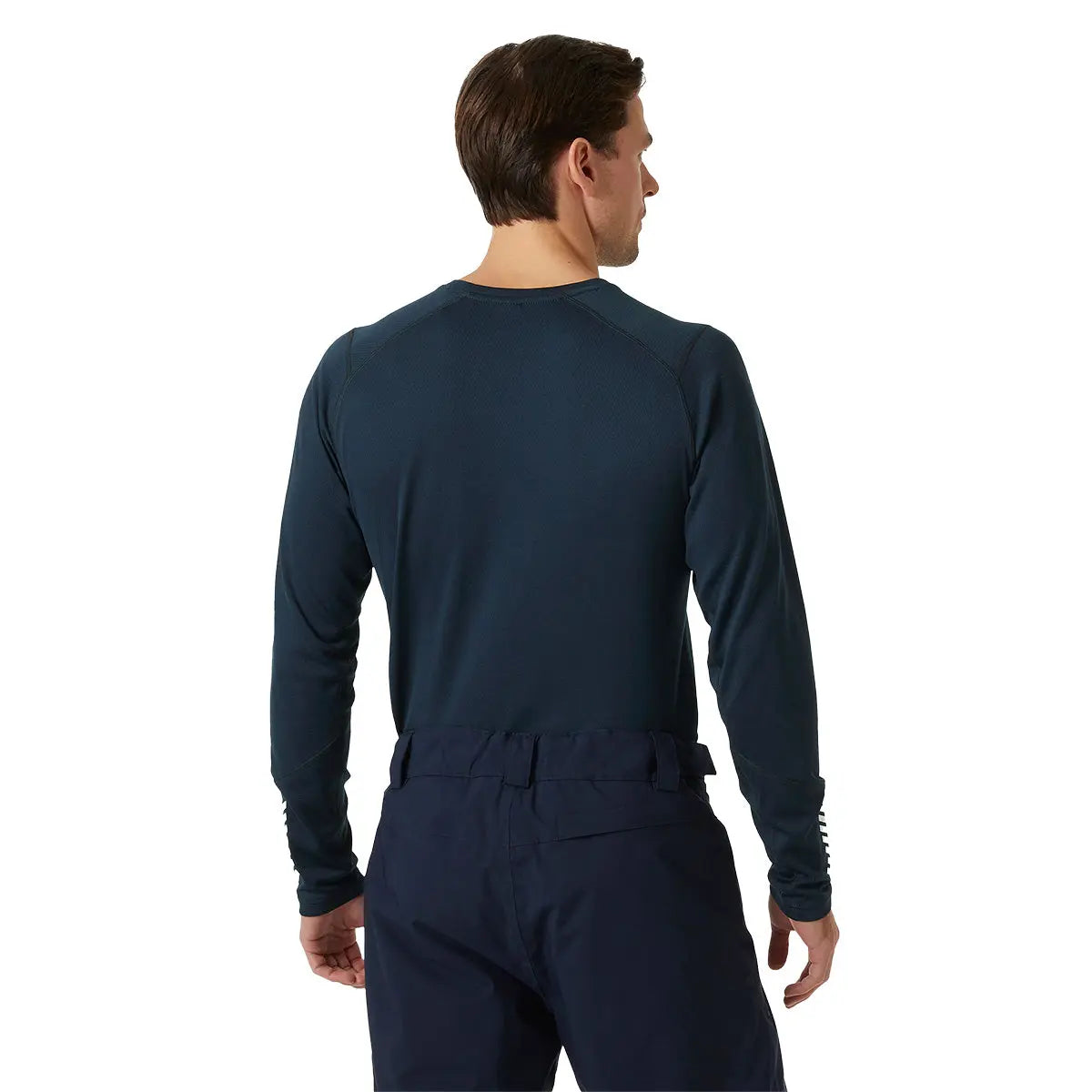 Model wearing navy HH Lifa Active Crew Long Sleeve Base Layer from the back, showcasing fit and athletic design at John Bulls.
