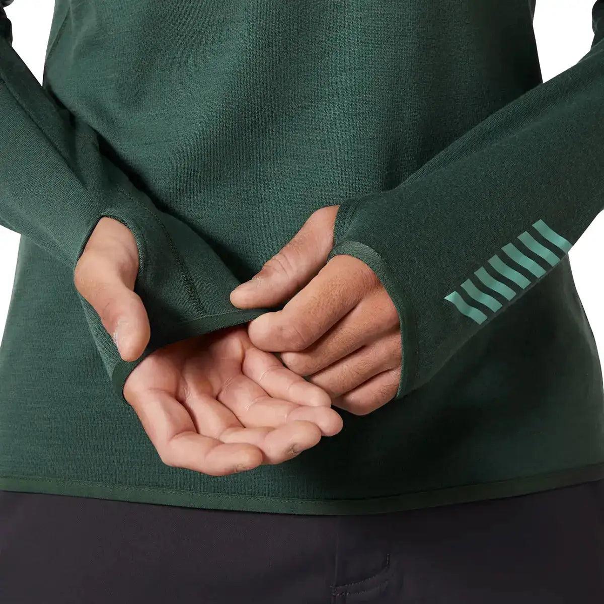 Detail of thumbholes on Helly Hansen Lifa Merino Wool Mid Layer 1/2 Zip sleeves, designed for added warmth and secure fit during movement. from John Bull Clothing