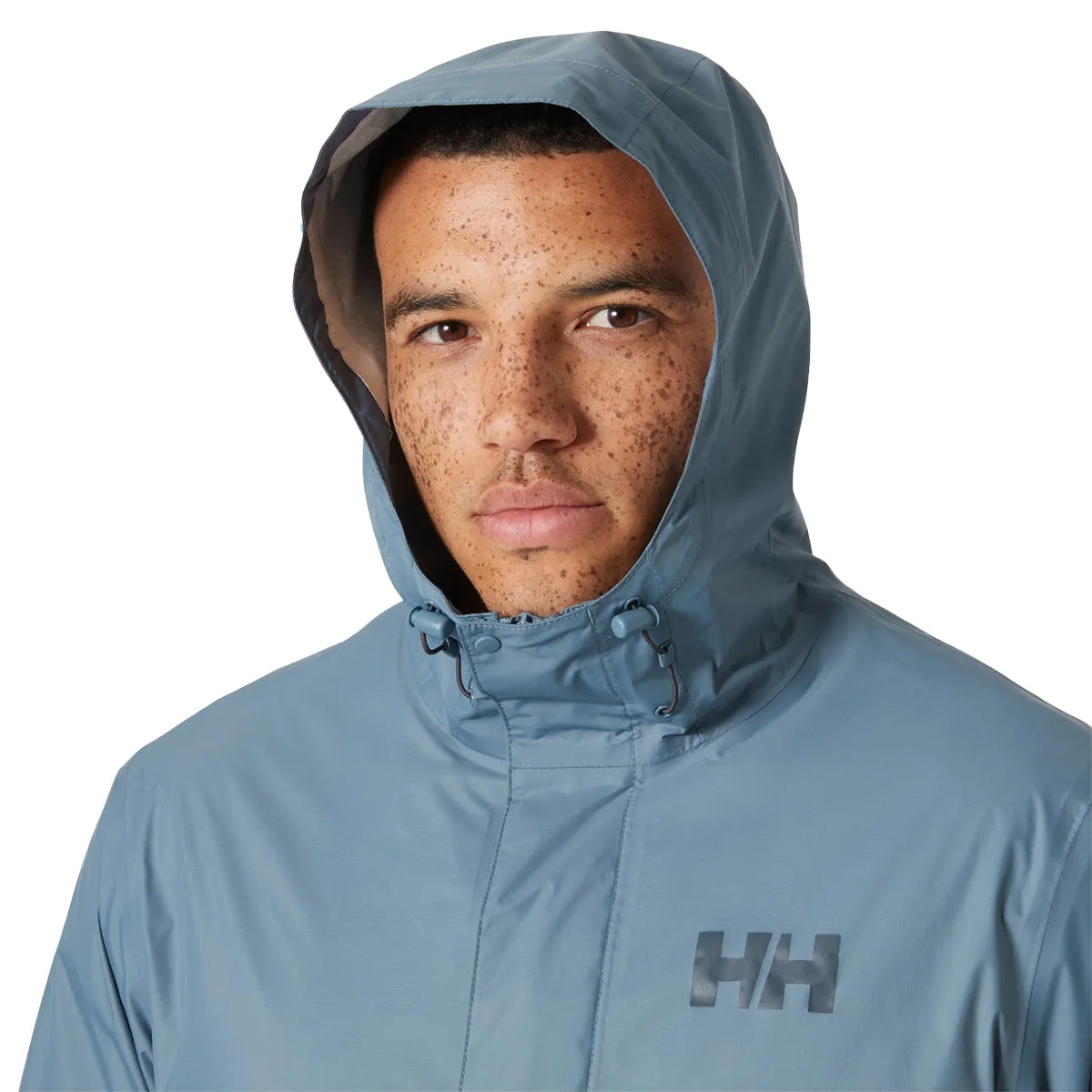 Close-up of model wearing Helly Hansen Mens Loke 2.0 Waterproof Jacket with hood up, showing face coverage and logo detail.