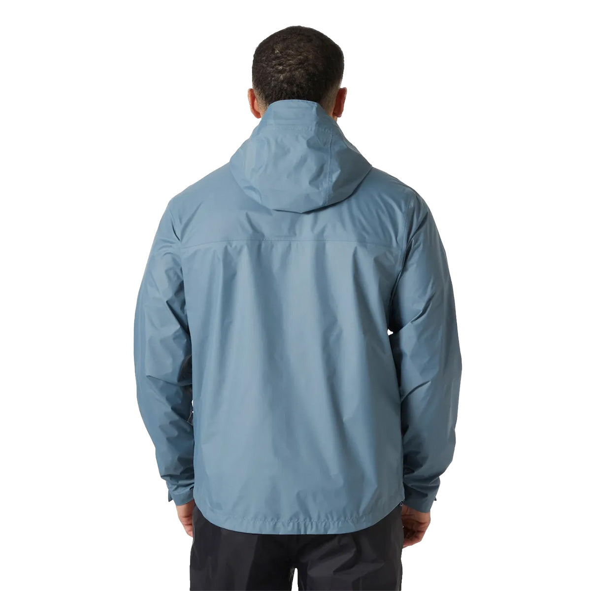 Rear view of model in Helly Hansen Mens Loke 2.0 Waterproof Jacket, highlighting the jacket’s back fit and hood design.