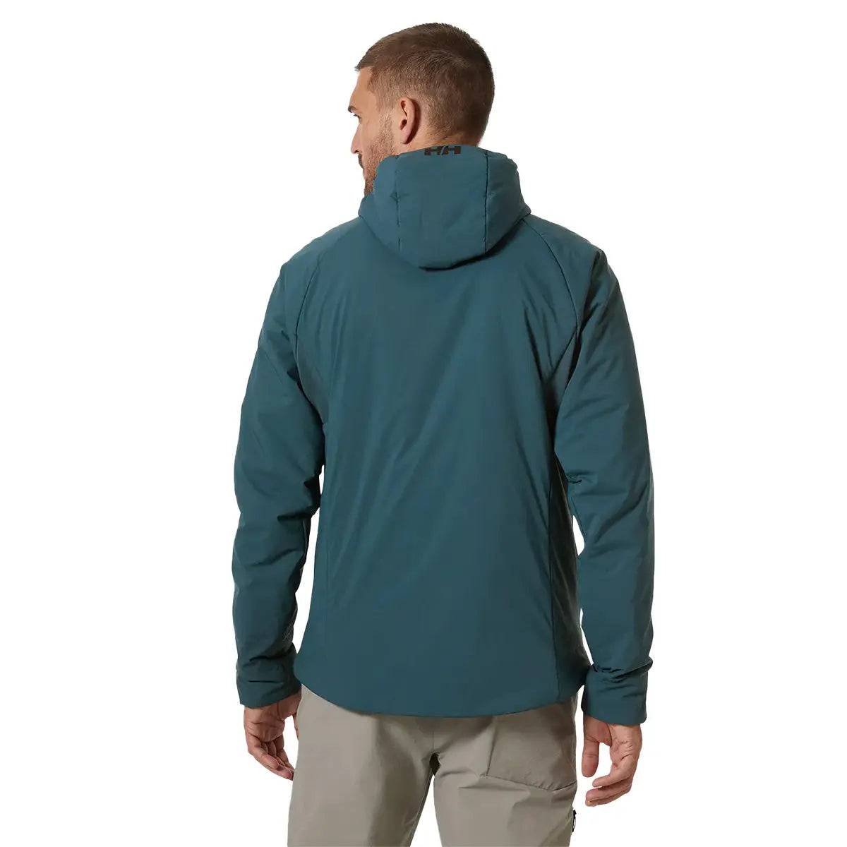Rear view of a model wearing the Helly Hansen Odin Stretch Hood Insulator 2.0 Jacket, showcasing its ergonomic fit and insulated hood for outdoor performance.