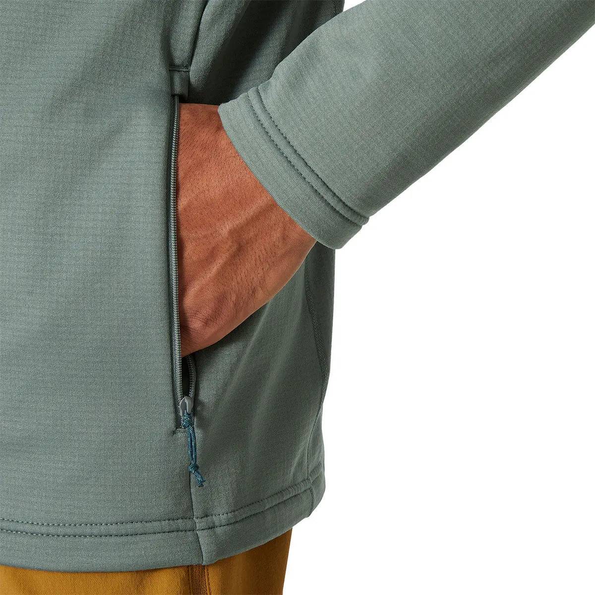 Close-up of the Helly Hansen Versalite Hooded Fleece Jacket's zippered side pocket, showcasing secure storage and durable stitching.