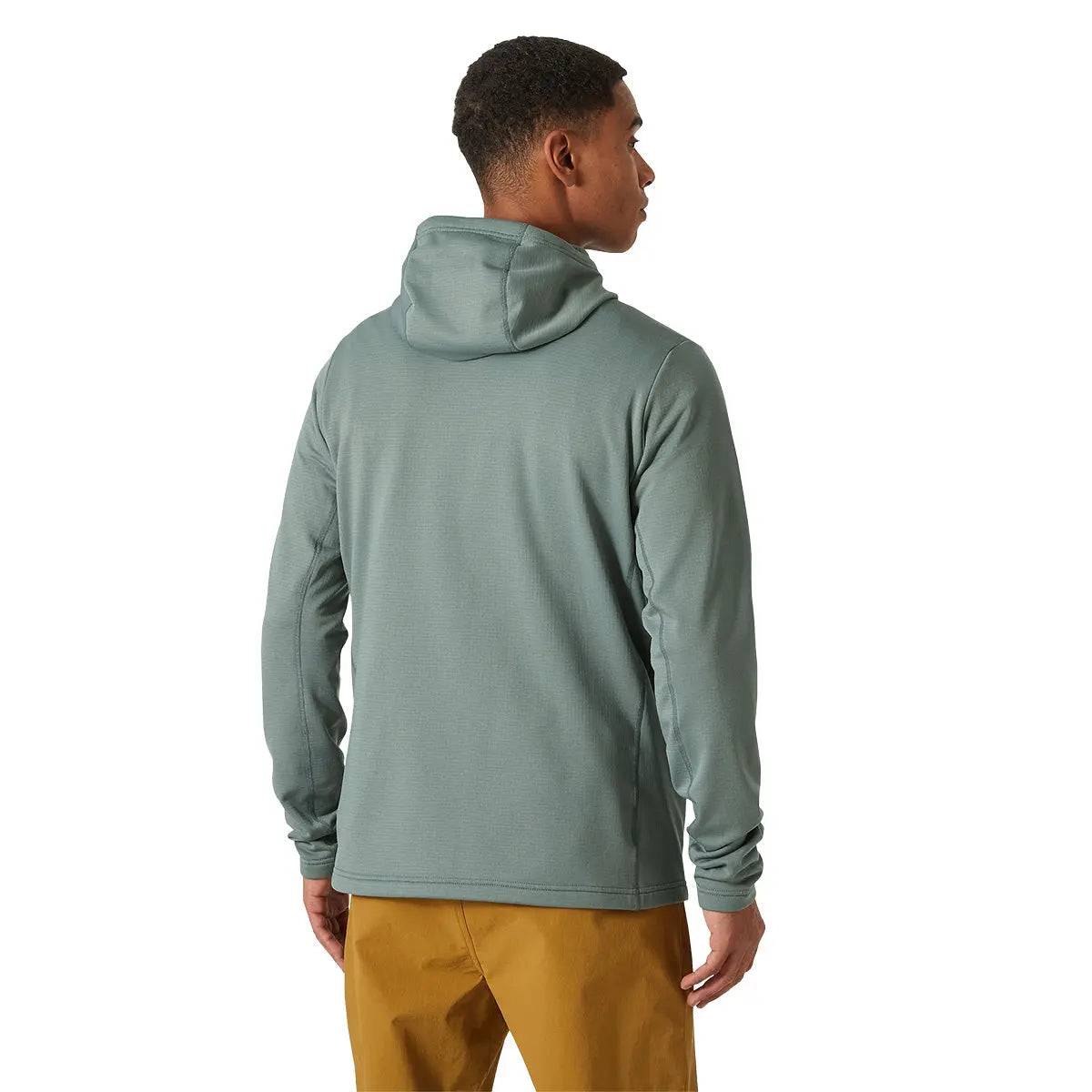 Rear view of a model wearing the Helly Hansen Versalite Hooded Fleece Jacket in green, showing the relaxed fit and hooded design for comfort.