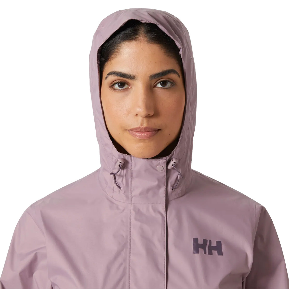 Close-up of model wearing hooded Helly Hansen Womans Loke 2.0 Waterproof Jacket, emphasizing face coverage and collar design.