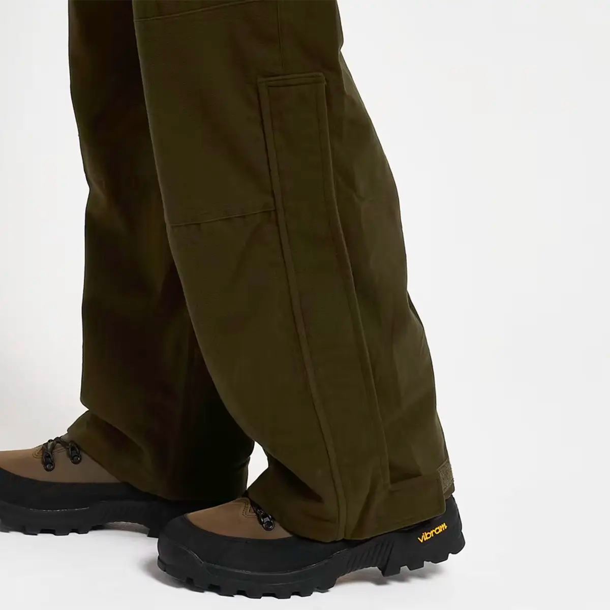 Zoomed-in view of leg hem and boot compatibility of Jack Pyke Hunters Trousers Green Waterproof, built for rugged outdoor use.