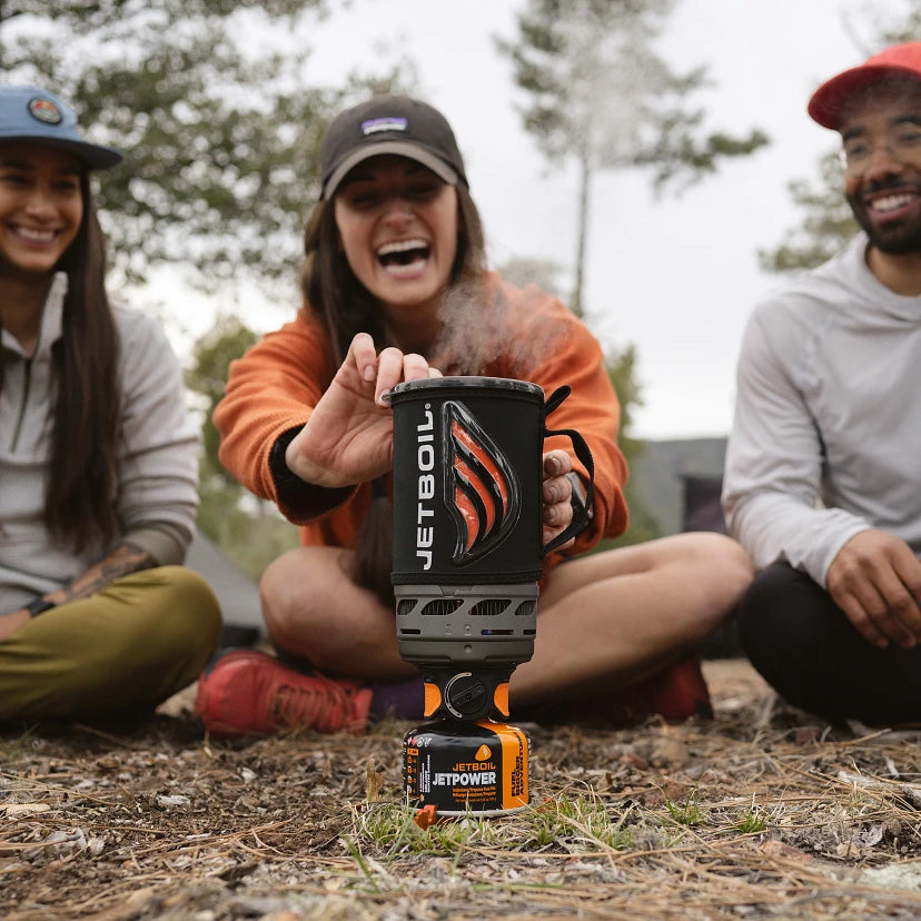 Group of campers using the Jetboil Flash 1.0L Fast Boil Stove System outdoors, enjoying a quick and efficient cooking experience.