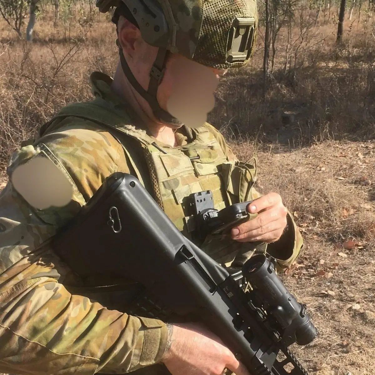 Soldier using Luminae Garmin Foretex Mount 601/701 in field, mounted on tactical vest for hands-free GPS access during operations.