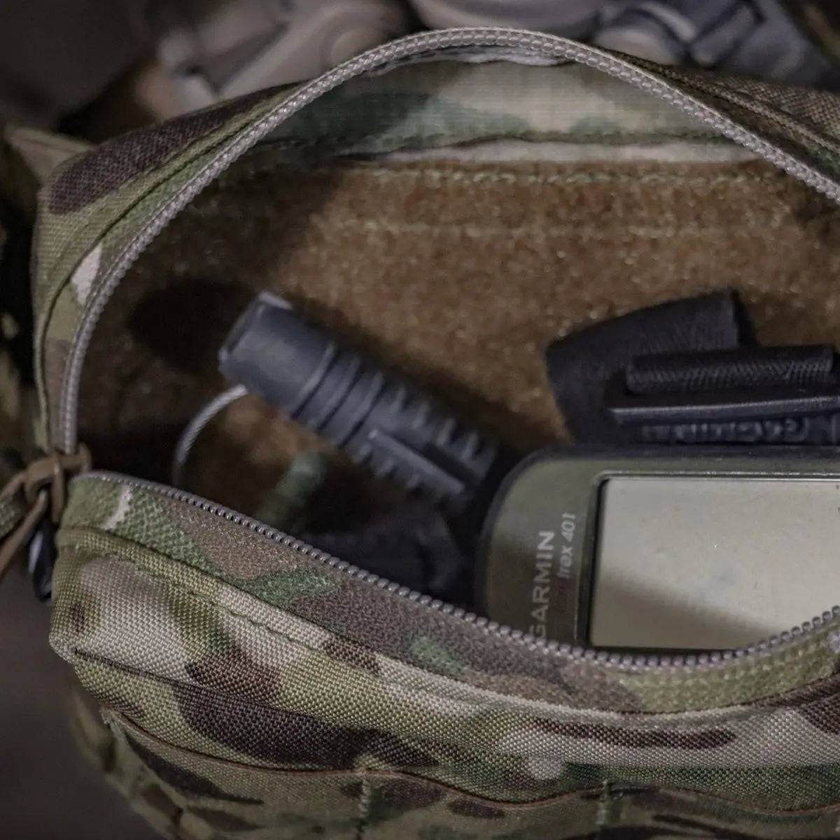 Open Luminae Multicam Small GP Pouch MTP with tactical gear inside, illustrating its spacious interior and secure storage for essential equipment.