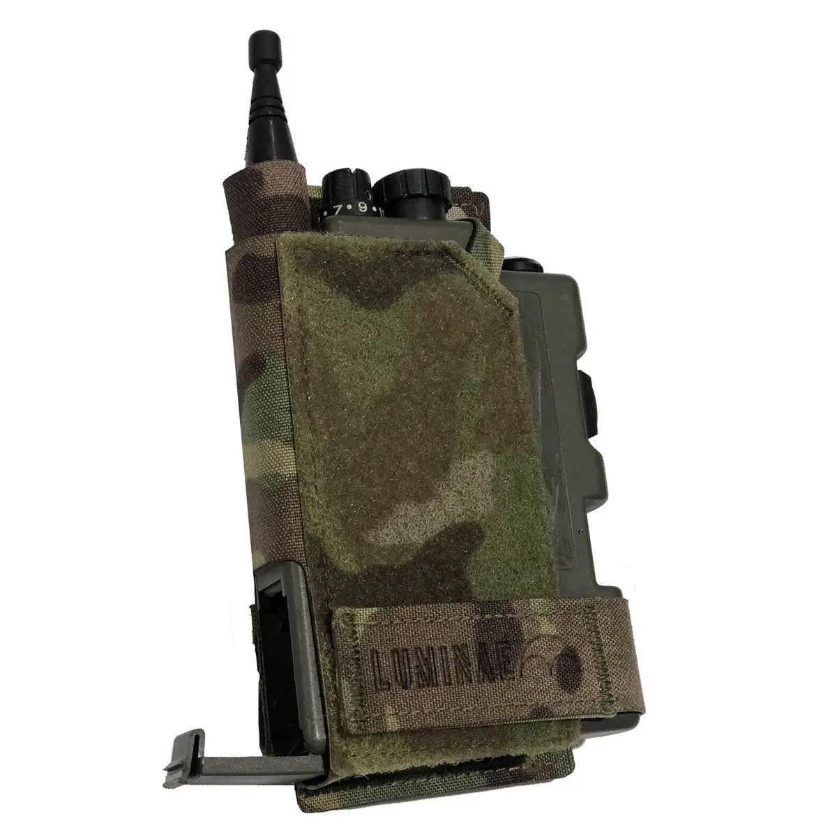 Angled view of the Luminae Multicam PRR Pouch MTP displaying its rugged Cordura material and secure fastening system for radio protection.