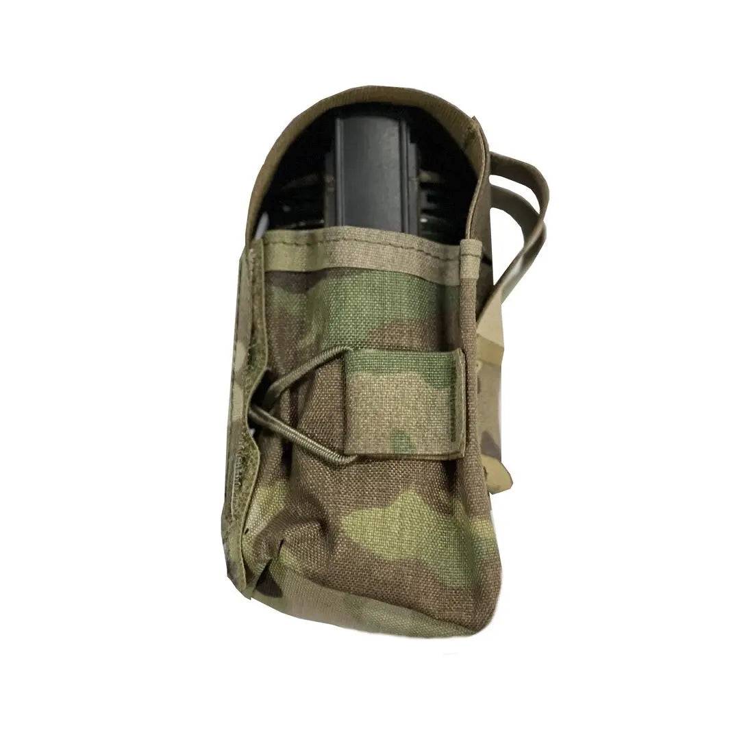 Side view of Luminae Multicam Smoke Grenade Pouch MTP with a smoke grenade partially inserted. Reinforced stitching ensures durability in rugged conditions.