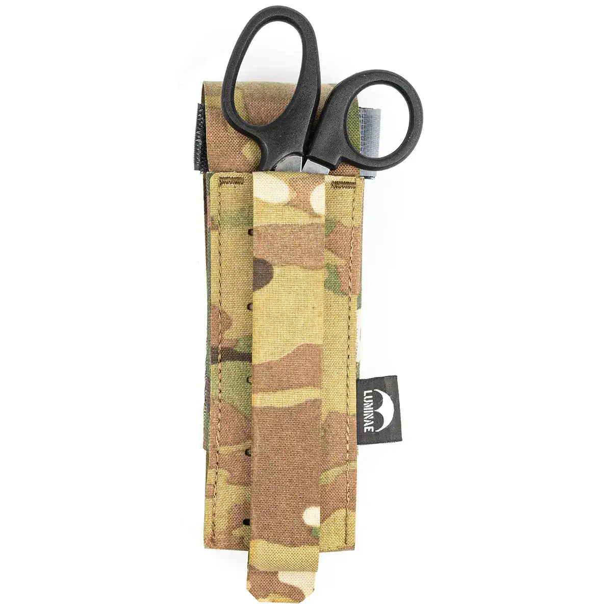 Multicam camouflage tourniquet pouch with black scissors and elastic strap, designed for military and tactical use, made of durable Cordura fabric.