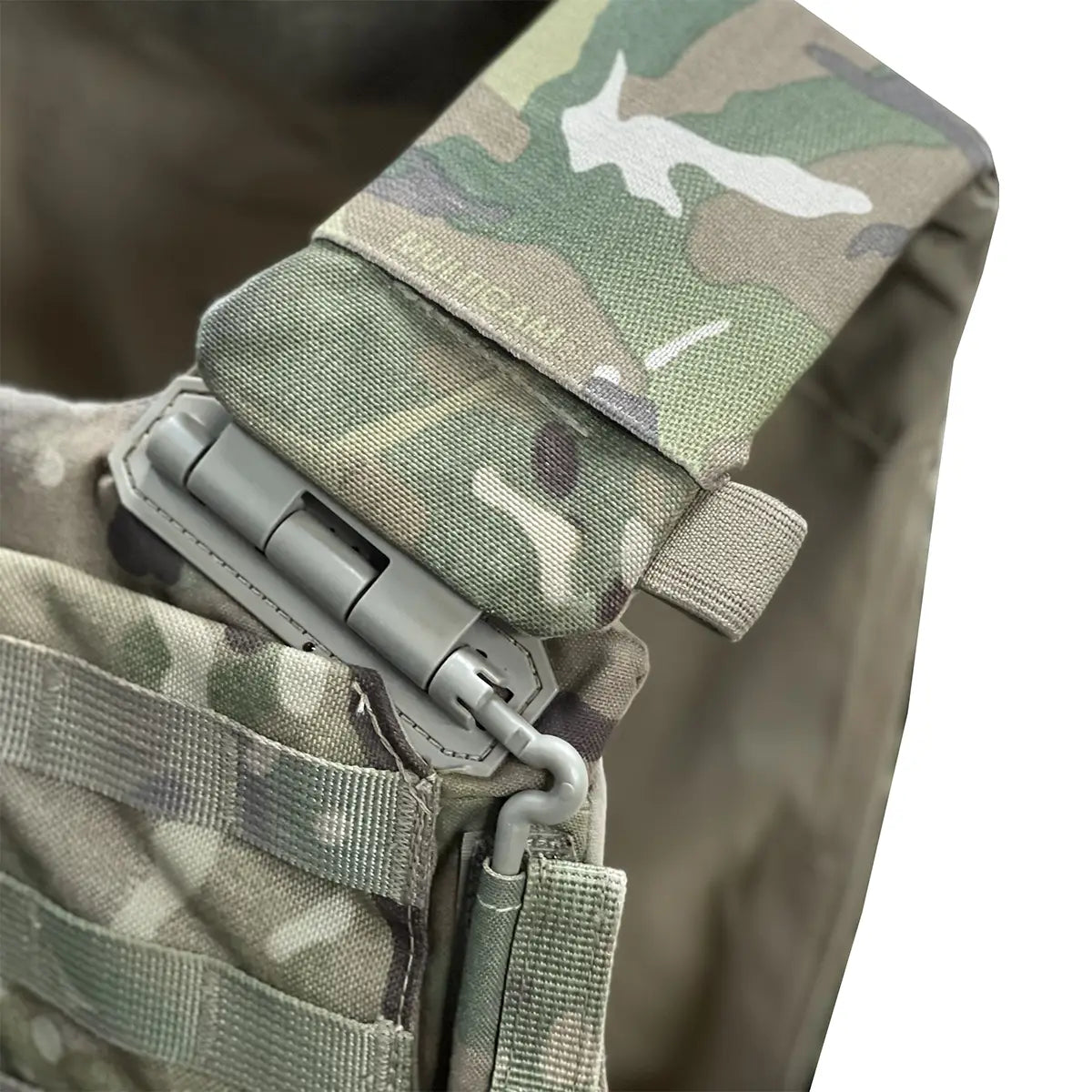 Luminae Virtus Shoulder Sleeves in Multicam pattern fitted on tactical vest strap, showcasing reinforced stitching and rugged design