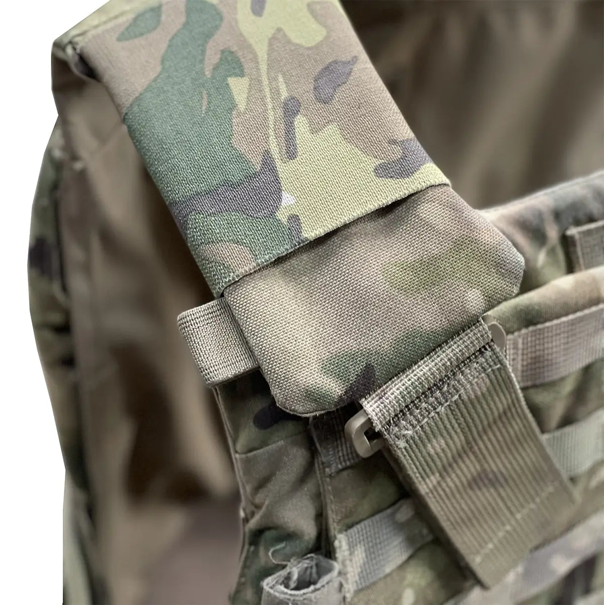 Close-up of Luminae Virtus Shoulder Sleeves installed on tactical vest, highlighting compact fit and heavy-duty Cordura material