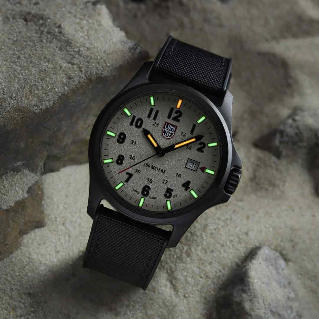Luminox Atacama Field 1960 Series Watch XL.1971.SET placed on sand, glowing markers visible, emphasizing its tactical and outdoor appeal.
