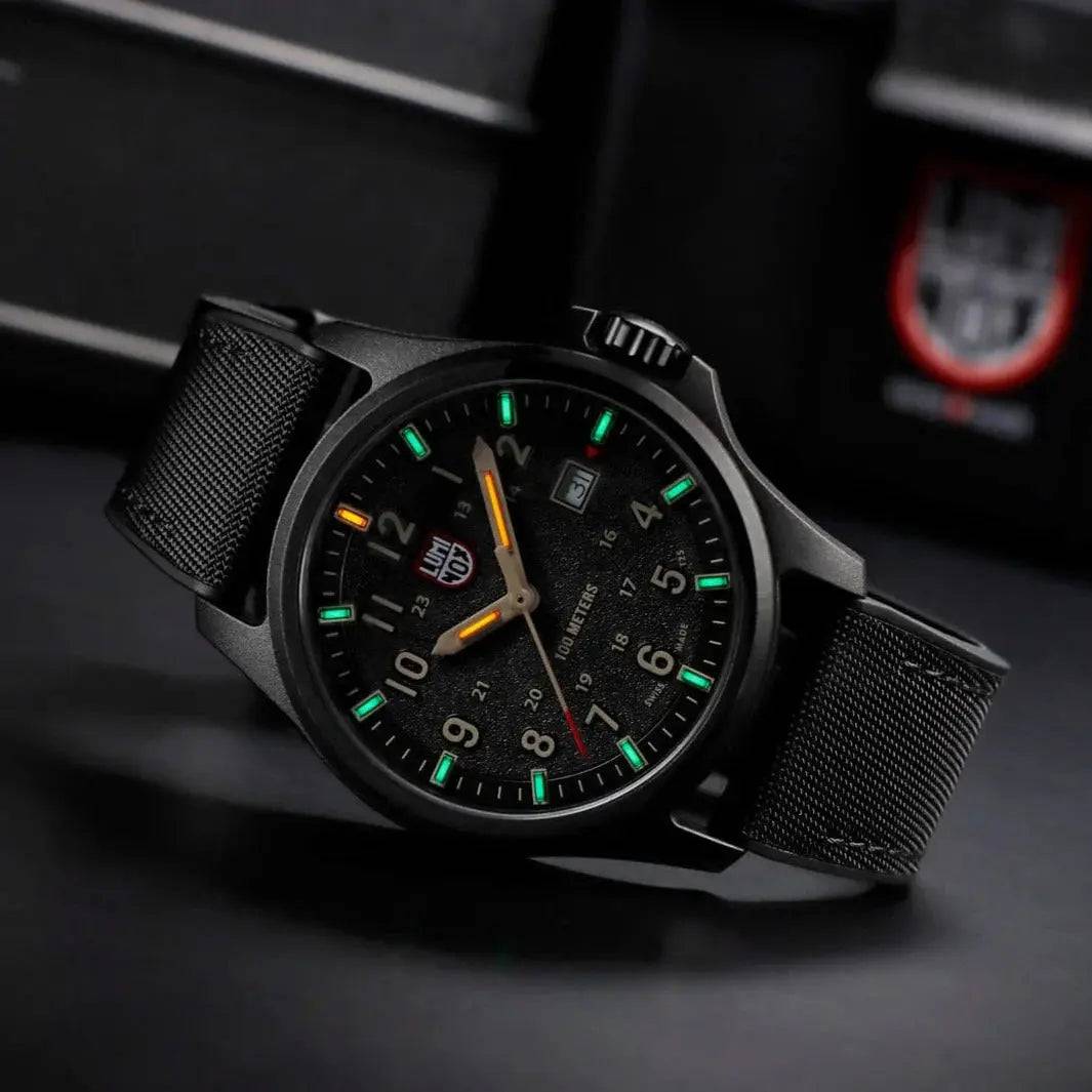 Luminox Atacama Field 1960 Series Watch XL.1970.SET glowing in the dark with green and orange luminescent markers, ensuring readability in low-light environments.