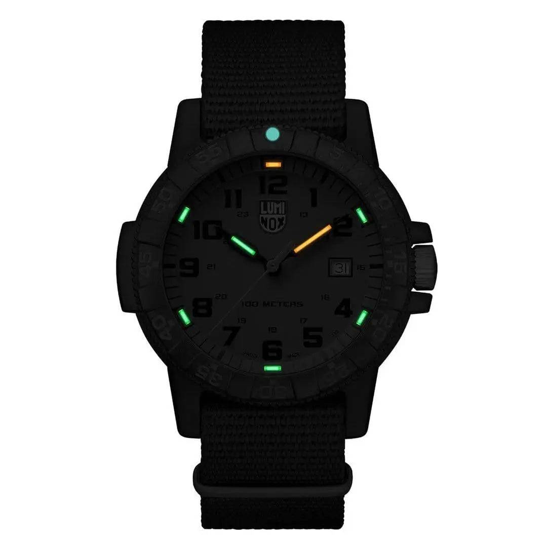 Luminox Leatherback Sea Turtle Giant 0320 Series Watch glowing in the dark with green and orange luminescent markers for enhanced visibility.