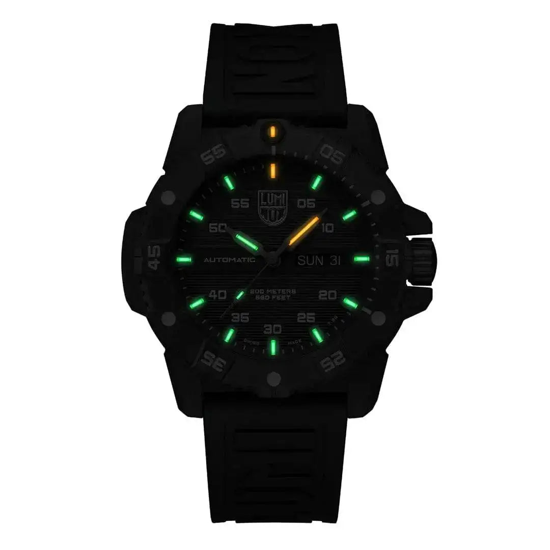 Luminox Master Carbon Seal Automatic 3860 Series Diver's Watch glowing in the dark with green and orange luminescent markers for night visibility. from John Bull Clothing