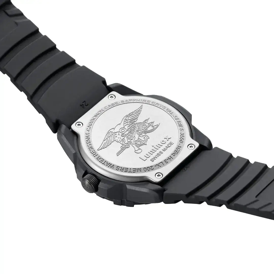 Back view of black Luminox Navy Seal 44mm diver watch showing engraved logo, stainless steel case back, and textured strap
