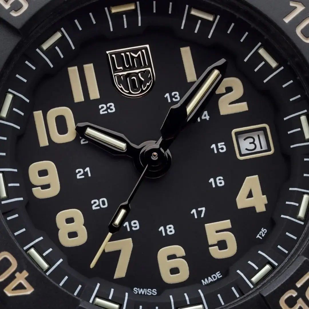 Close-up of Luminox Navy Seal Military Black Dive Watch 45mm XS.3510 dial showing beige numerals, Swiss Made label, and date window at 3 o'clock.