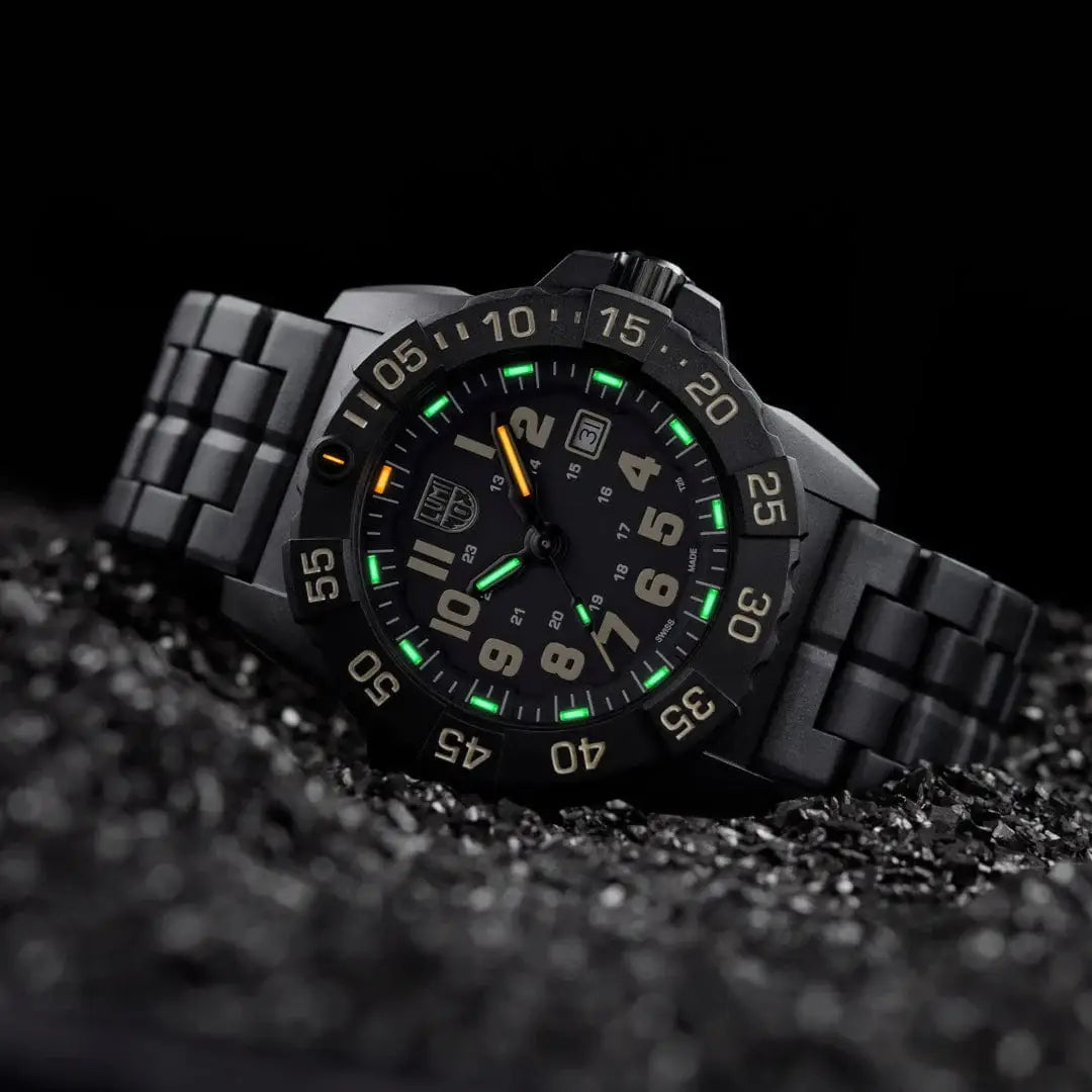Luminox Navy Seal Military Black Dive Watch 45mm XS.3510 displayed on black gravel, highlighting its tactical design and luminous dial.