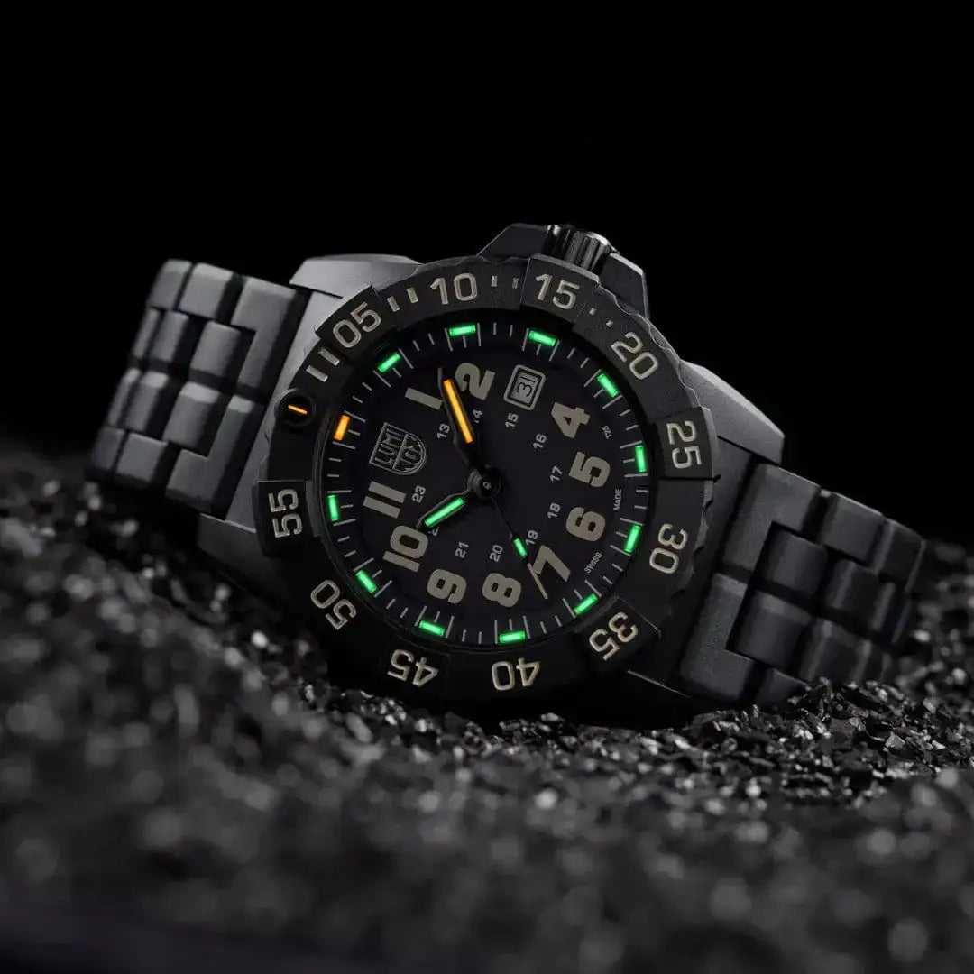 Luminox Navy Seal Military Black Dive Watch 45mm XS.3510 displayed on black gravel, highlighting its tactical design and luminous dial. from John Bull Clothing