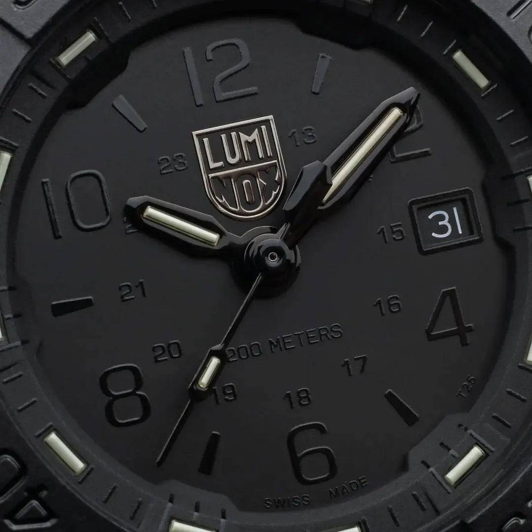 Close-up of the Luminox Navy Seal Steel 3250 Series Black 45mm XS.3251.BO.CB watch face, featuring a black dial, luminous hands, and date display.