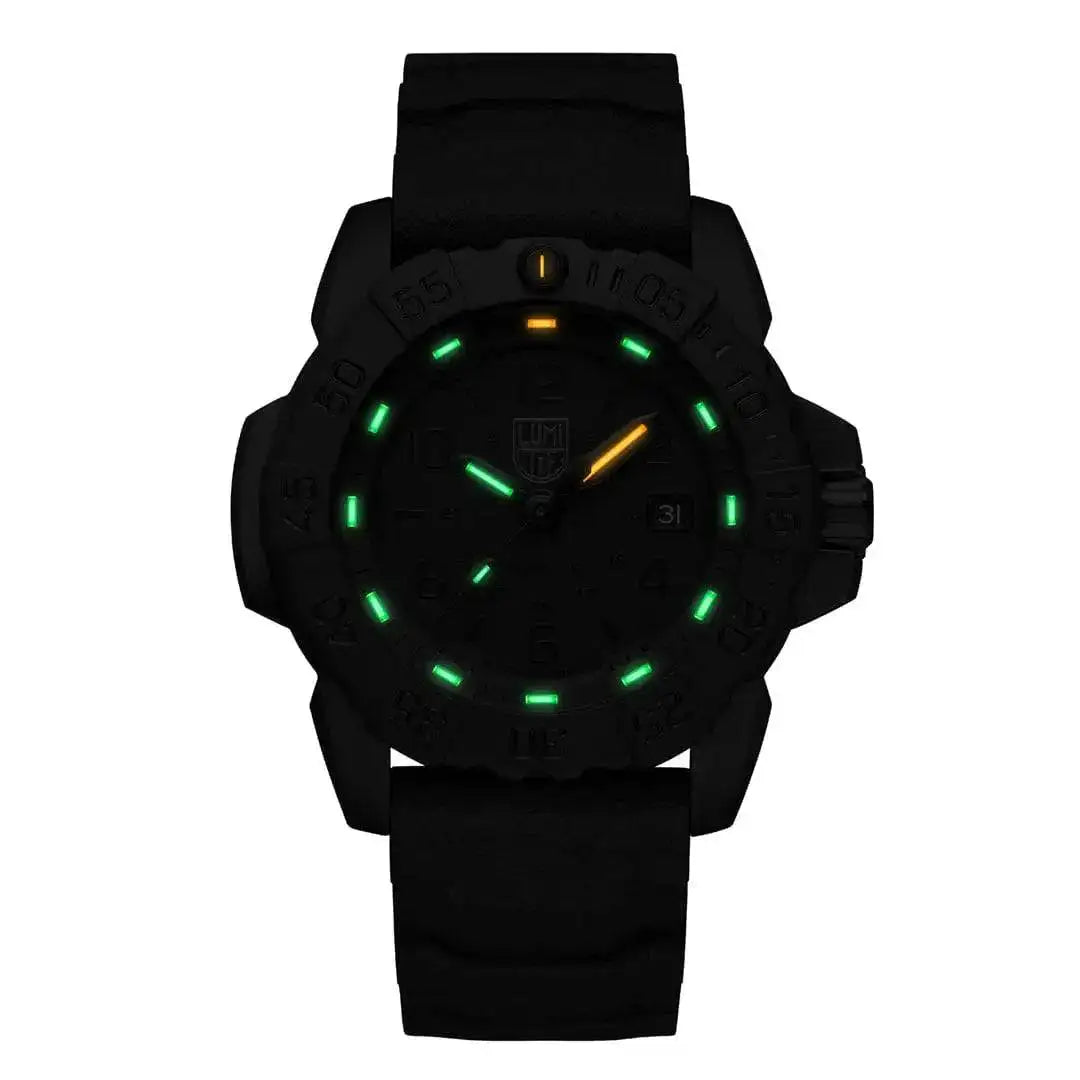 Luminox Navy Seal Steel 3250 Series Black 45mm XS.3251.BO.CB watch in low-light conditions, showcasing its green and orange self-powered illumination. from John Bull Clothing