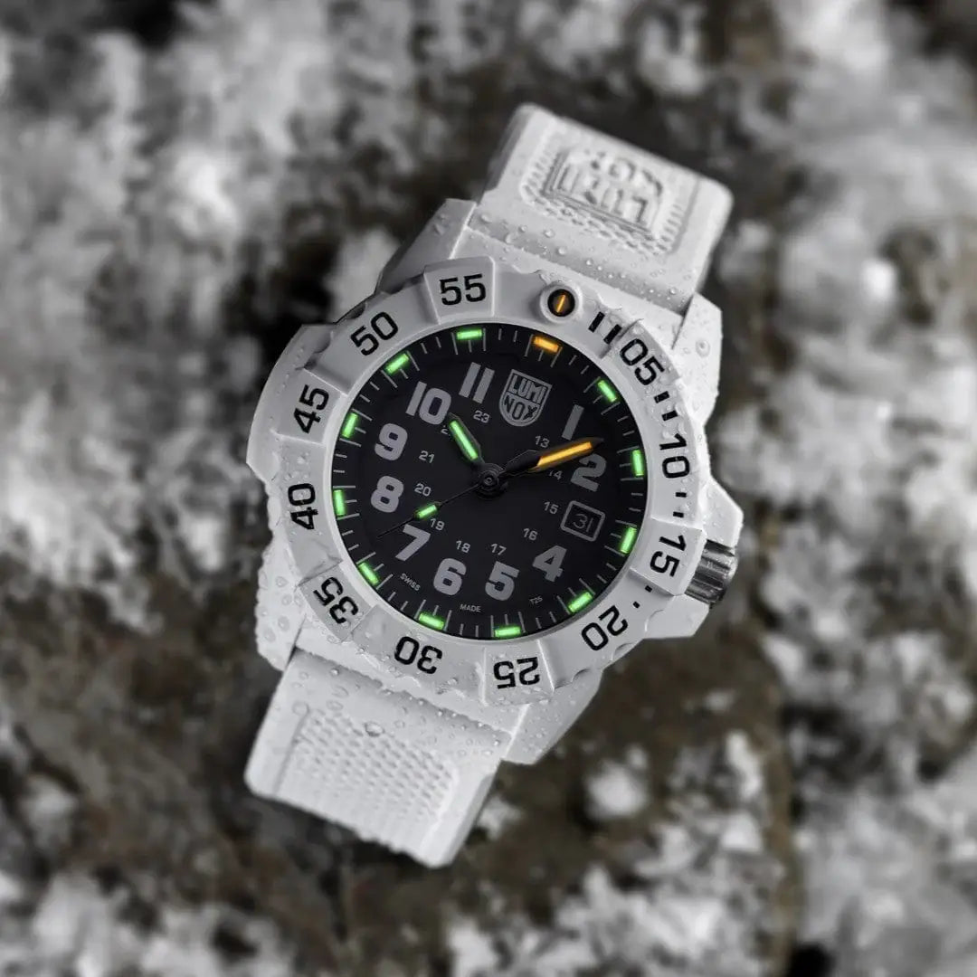 Luminox Navy Seal White Military Dive Watch 45mm XS.3507.WB displayed on icy terrain, highlighting its durability in extreme cold conditions.