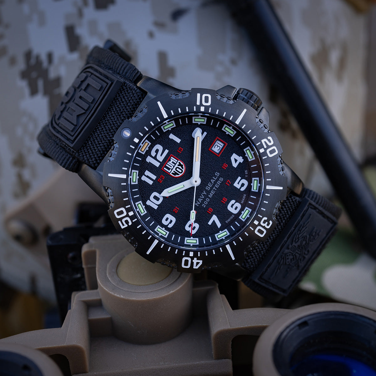 Luminox Navy Series Watch 4230 Series XS.4231.SET placed on military gear, highlighting its tactical design and luminous dial for night visibility.