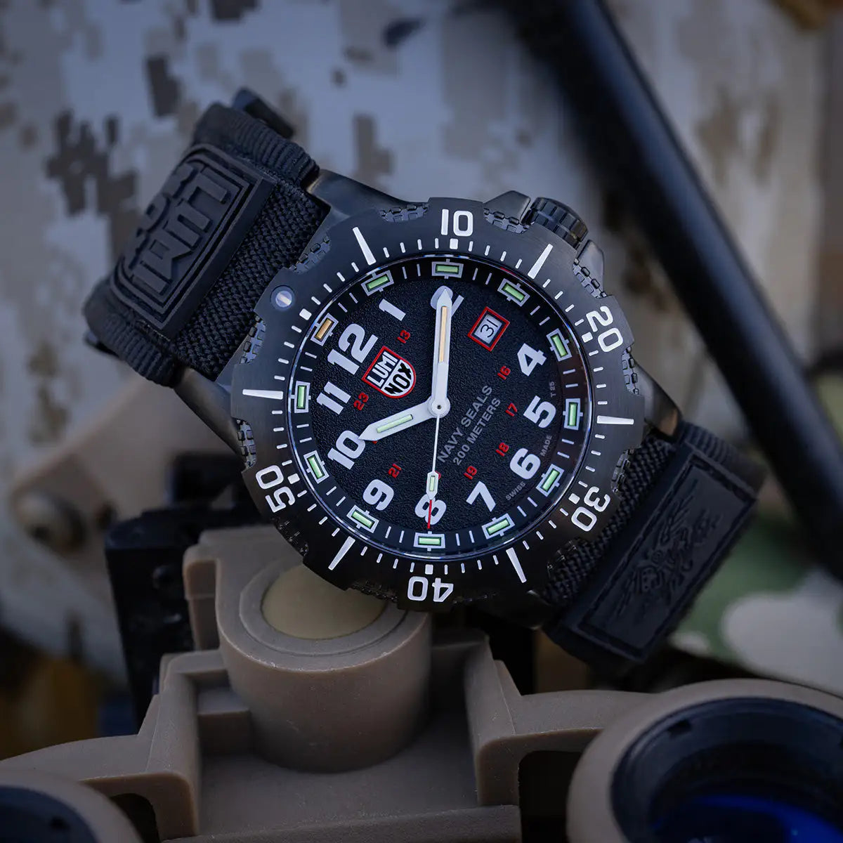 Luminox Navy Series Watch 4230 Series XS.4231.SET placed on military gear, highlighting its tactical design and luminous dial for night visibility. from John Bull Clothing