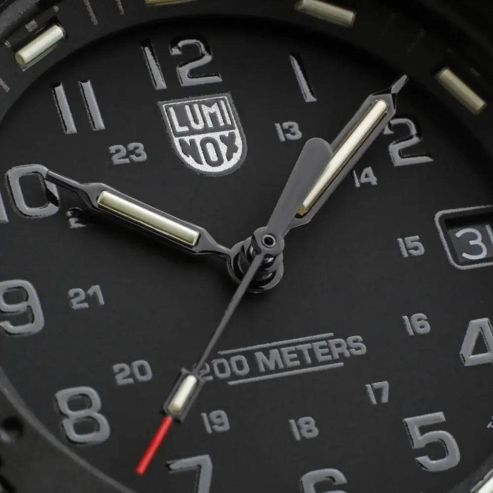 Close-up of the Luminox Original Navy Seal 3000 Series Watch dial, showcasing luminous hands and a rugged black design for tactical use.