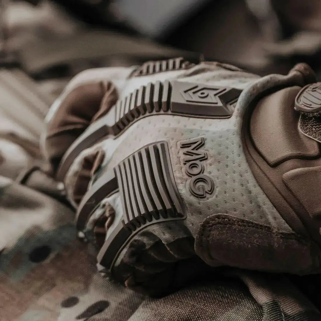 Detailed view of MoG Target High Abrasion Ergoshield Gloves in Multicam showing textured backhand protection and branding for industrial and tactical use. from John Bull Clothing