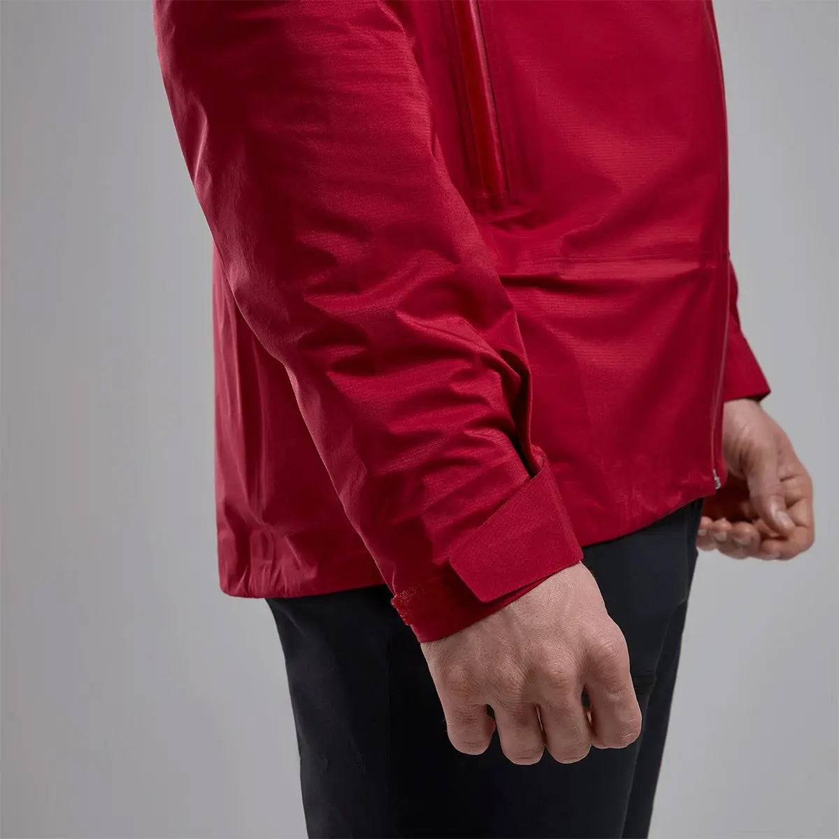 Detailed view of Montane Mens Cetus Lite Waterproof Jacket in red, showcasing the adjustable cuff design for a secure and comfortable fit.