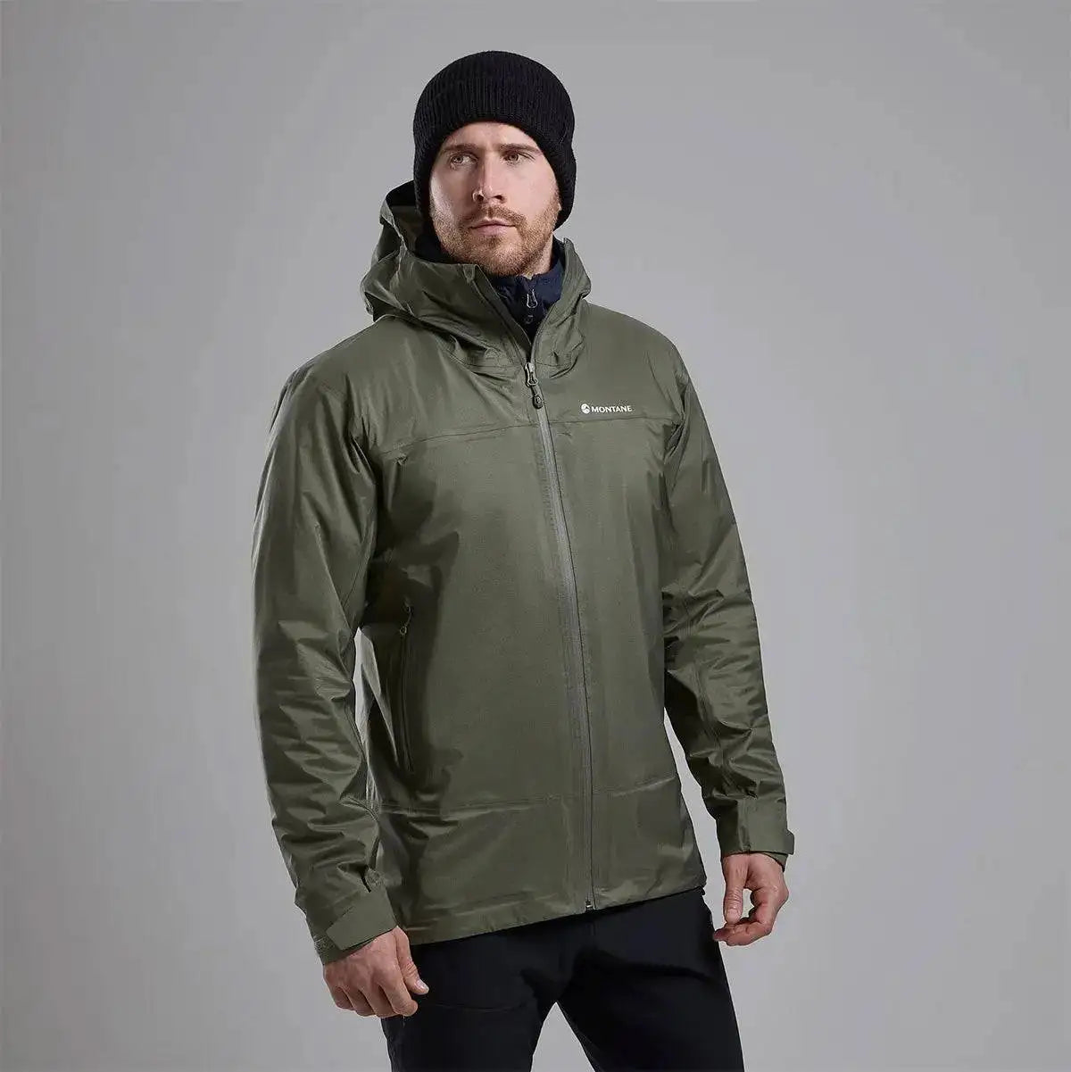 Model wearing Montane Mens Cetus Lite Waterproof Jacket in olive green, showcasing its comfortable fit and weather-resistant features. from John Bull Clothing