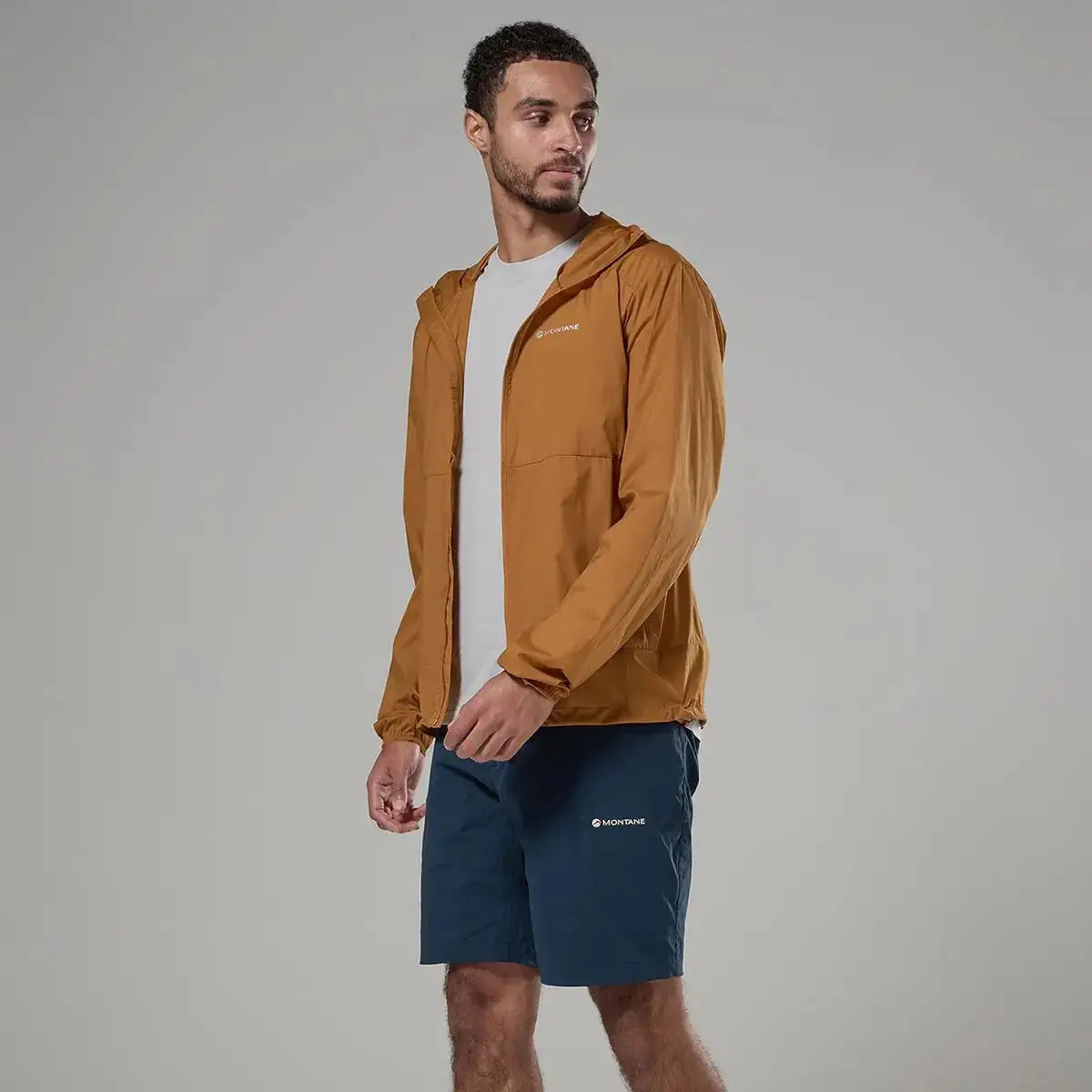 Men wearing tan hooded windbreaker jacket, outdoor apparel for wind resistance from John Bull Clothing