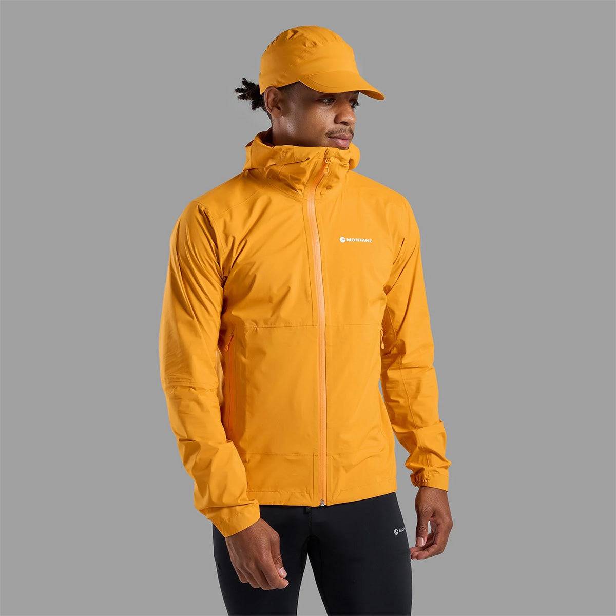 Front view of Montane Mens Minimus Lite Waterproof Jacket in orange worn by model, perfect for trail runners and fast-packers.