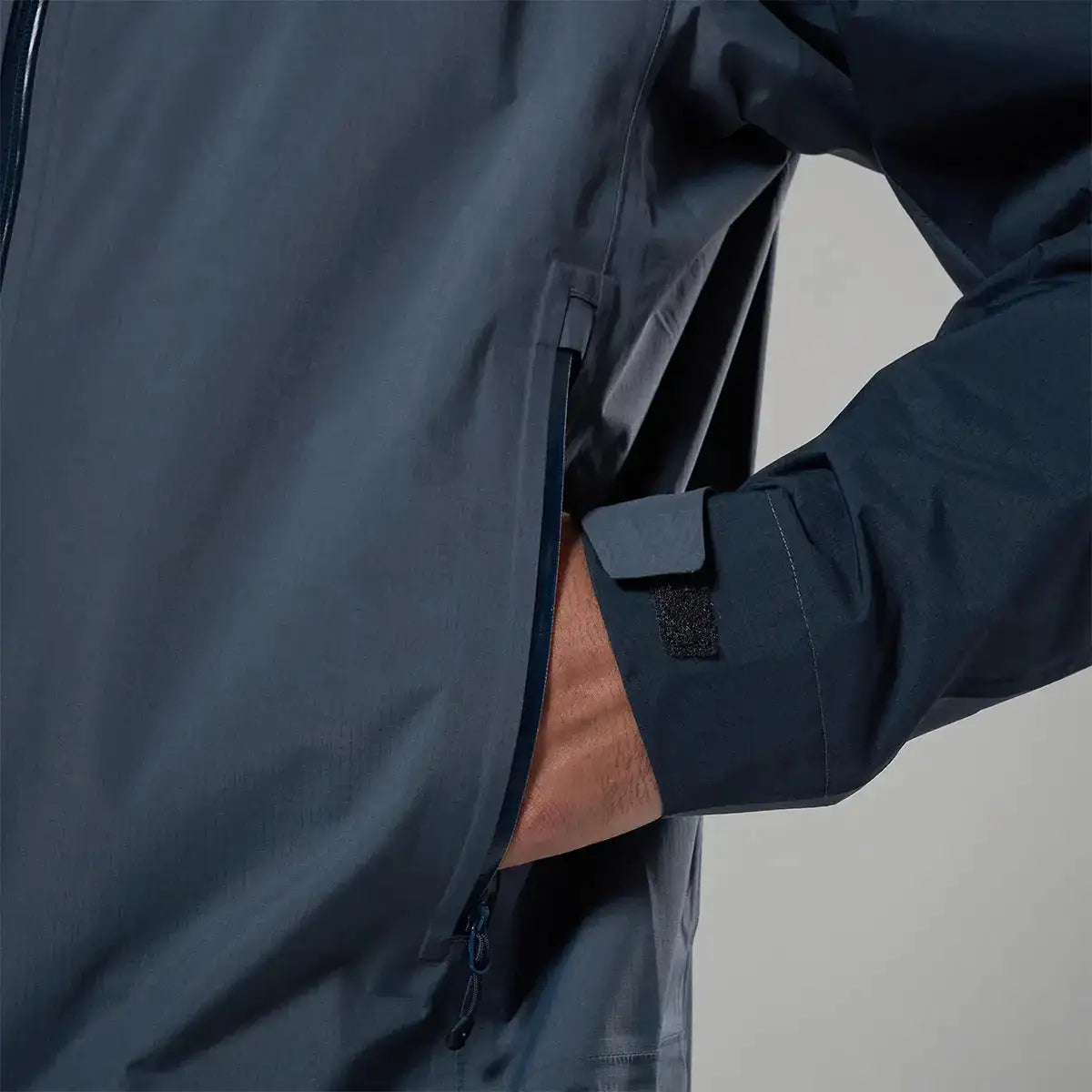 Close-up of Montane waterproof jacket with zipper and pocket detail from John Bull Clothing