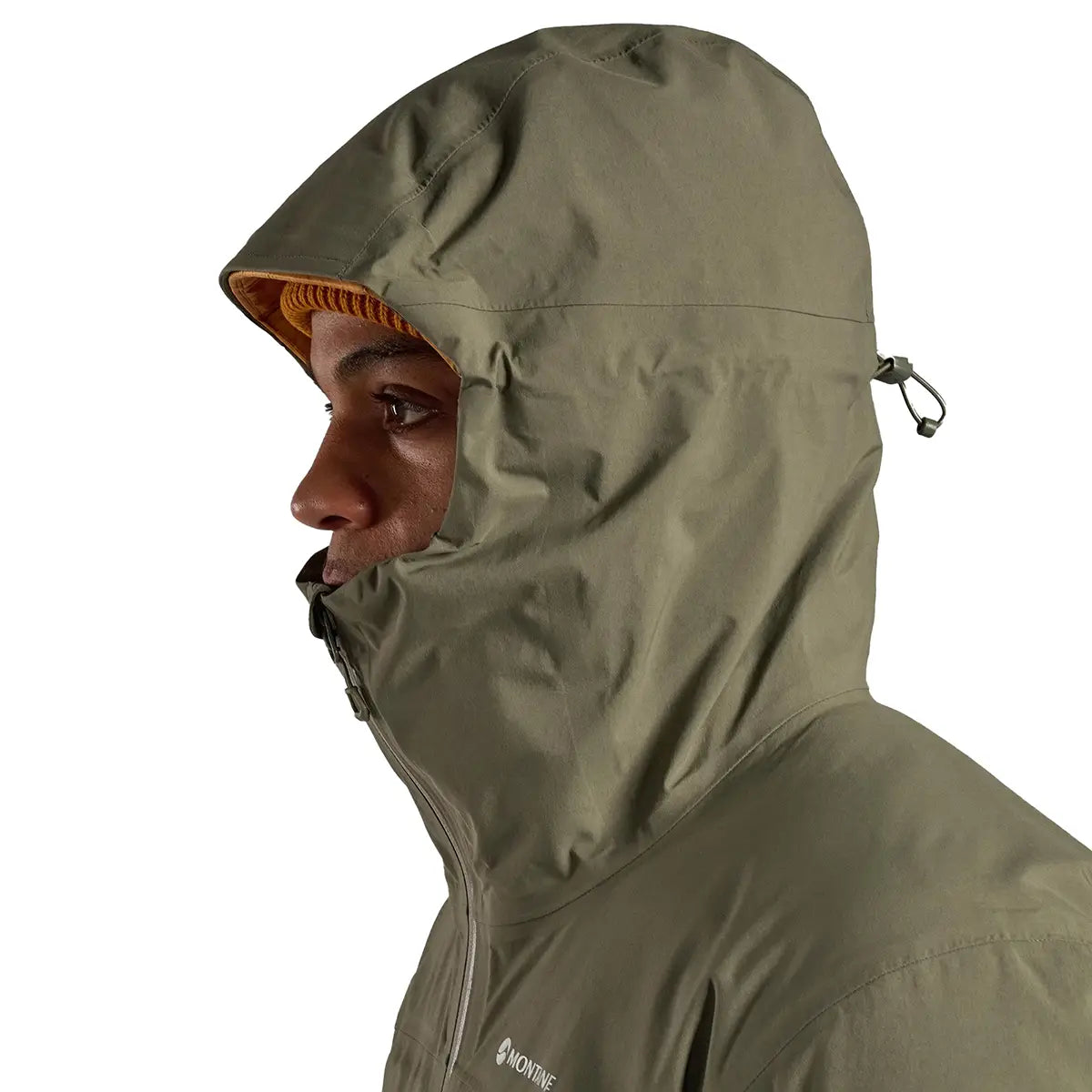 Close-up side view of Montane Mens Phase Goretex Waterproof Jacket hood in green, highlighting adjustable drawcord and weatherproof fit.
