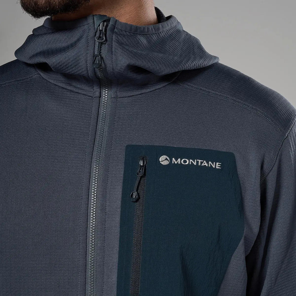 Close-up of Montane men's Protium CP hoodie fleece jacket in dark gray, with zippered chest pocket