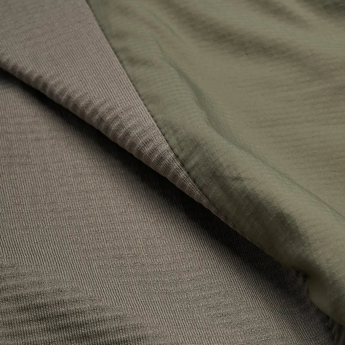 Fabric detail of Montane Mens Sirocco Hooded Insulated Jacket showing texture and quality of PrimaLoft Gold Active insulation.