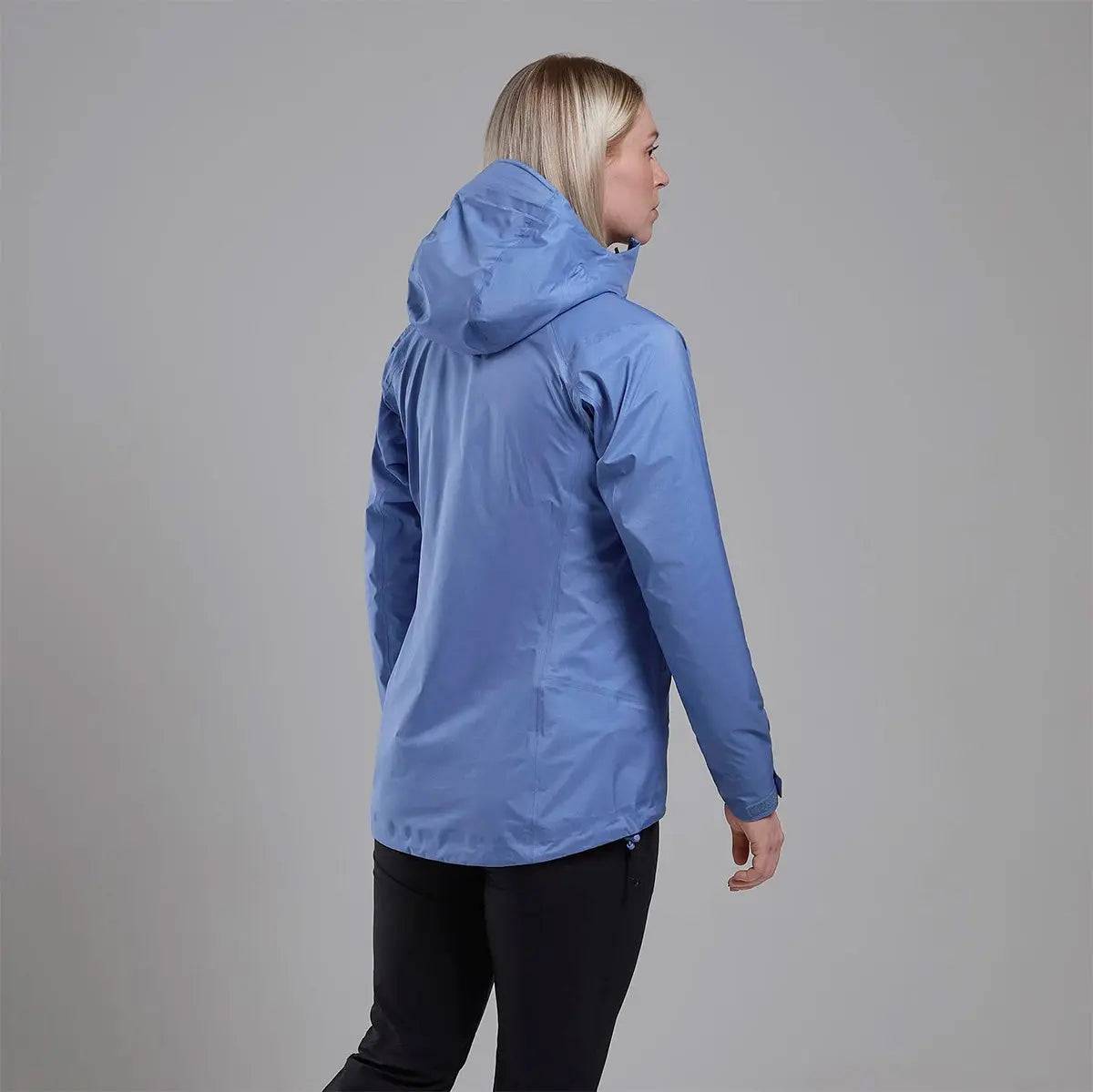 Back view of Montane Women's Cetus Lite Waterproof Jacket in light blue, showcasing its streamlined design and hood coverage.