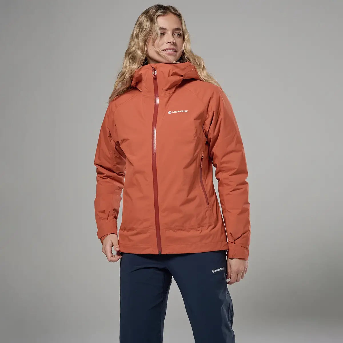 Montane waterproof jacket for women in orange, outdoor apparel