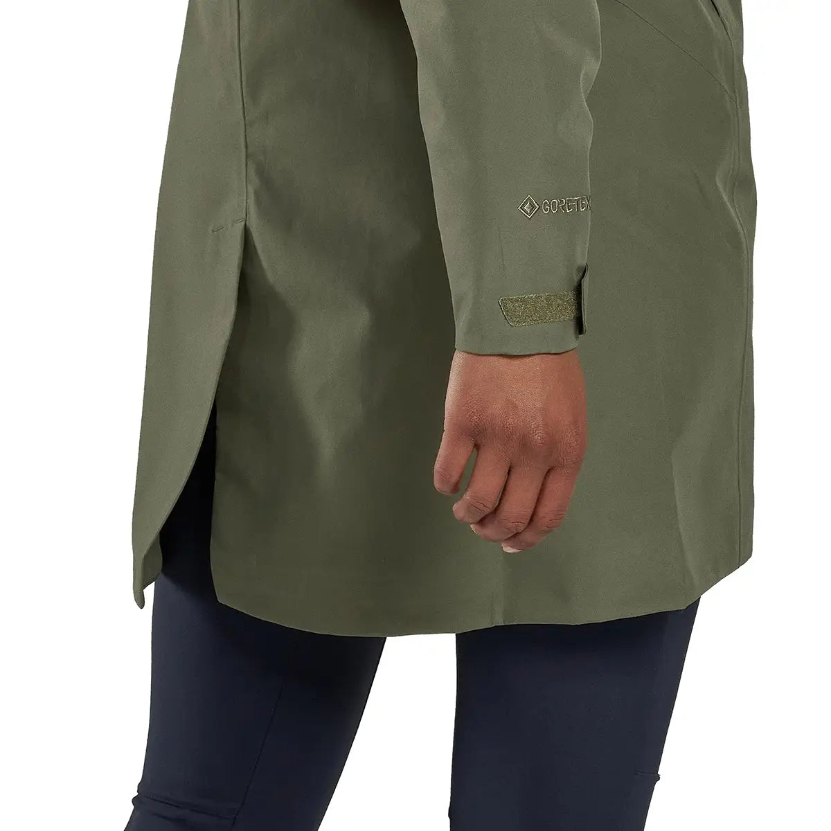 Close-up of sleeve and side slit on Montane Womens Spirit Long Goretex Waterproof Jacket in Caper green, showing Gore-Tex branding and cuff detail.