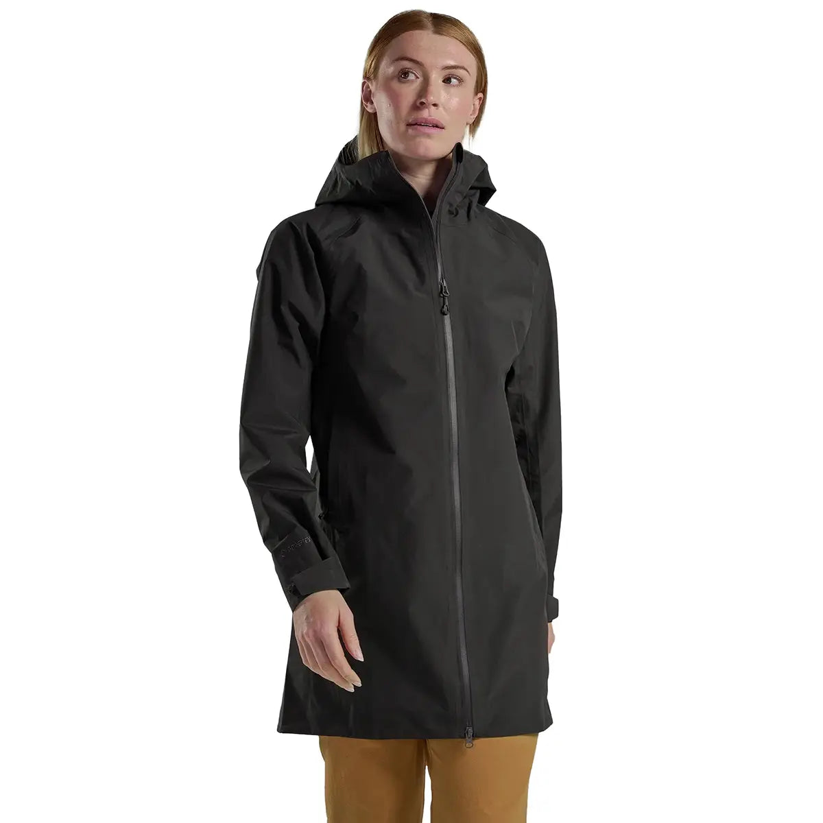 Model in Montane Womens Spirit Long Goretex Waterproof Jacket in Midnight Grey, demonstrating stylish and functional rain protection.