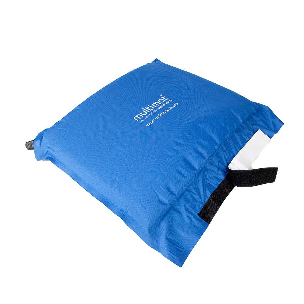 Folded Multimat Self Inflating Pillow Cushion Blue with Velcro strap, compact for easy packing in camping and hiking gear.