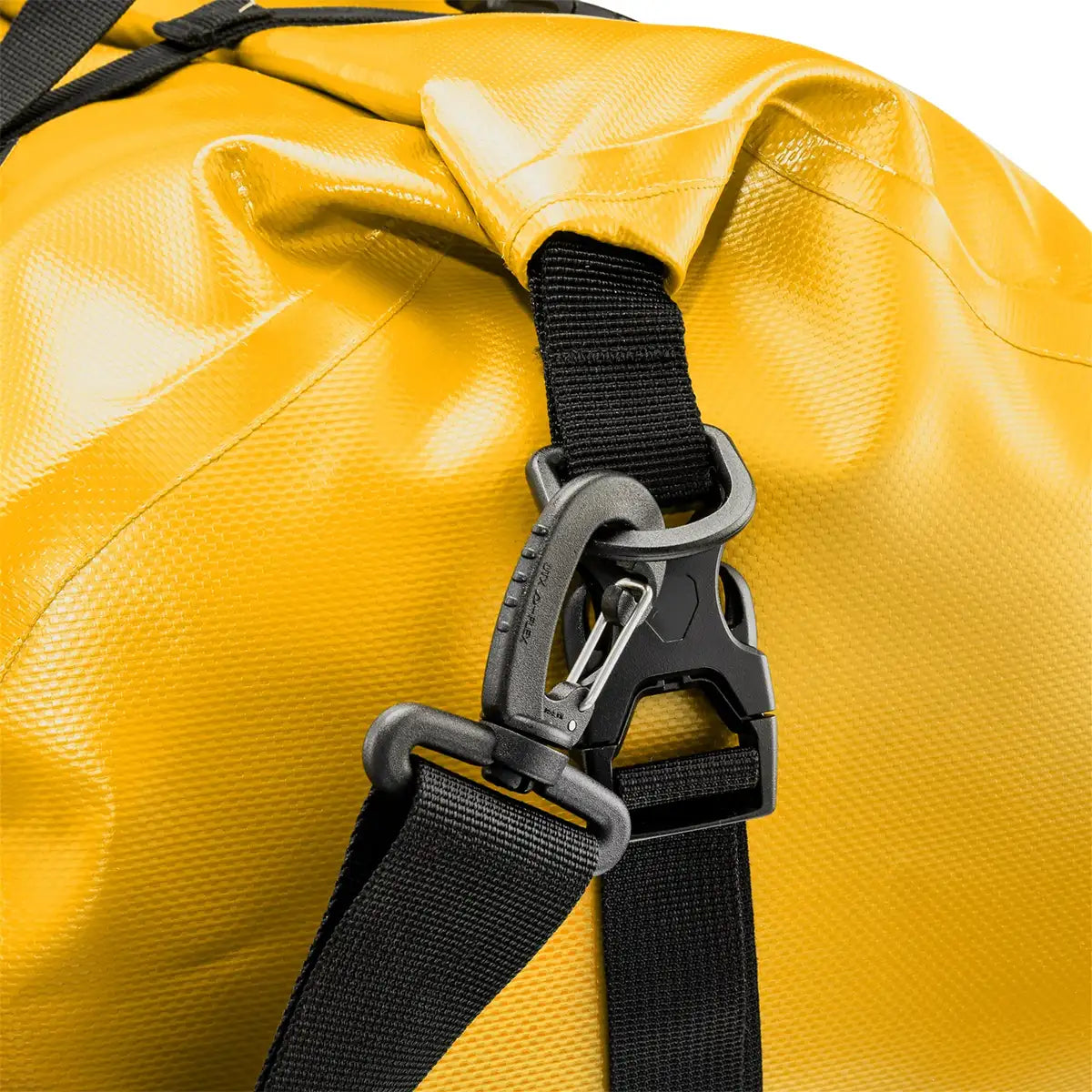 Detail of yellow Ortlieb Rack Pack 31L Waterproof Duffle Bag showing heavy-duty strap clip for secure shoulder strap attachment.