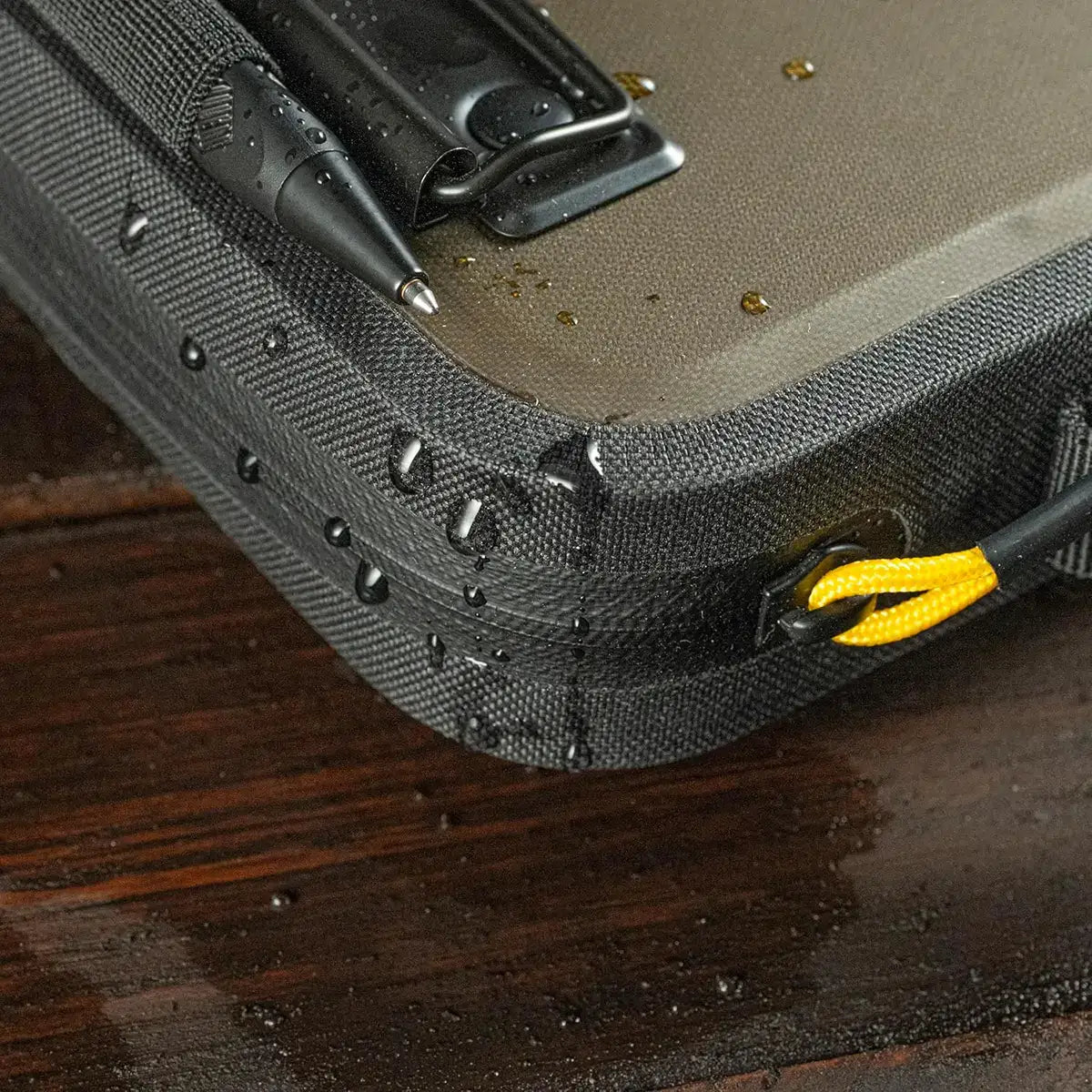 Interior of the Rite in the Rain waterproof A5 desk holder with organized compartments, elastic loops, and water-resistant lining for office or field use