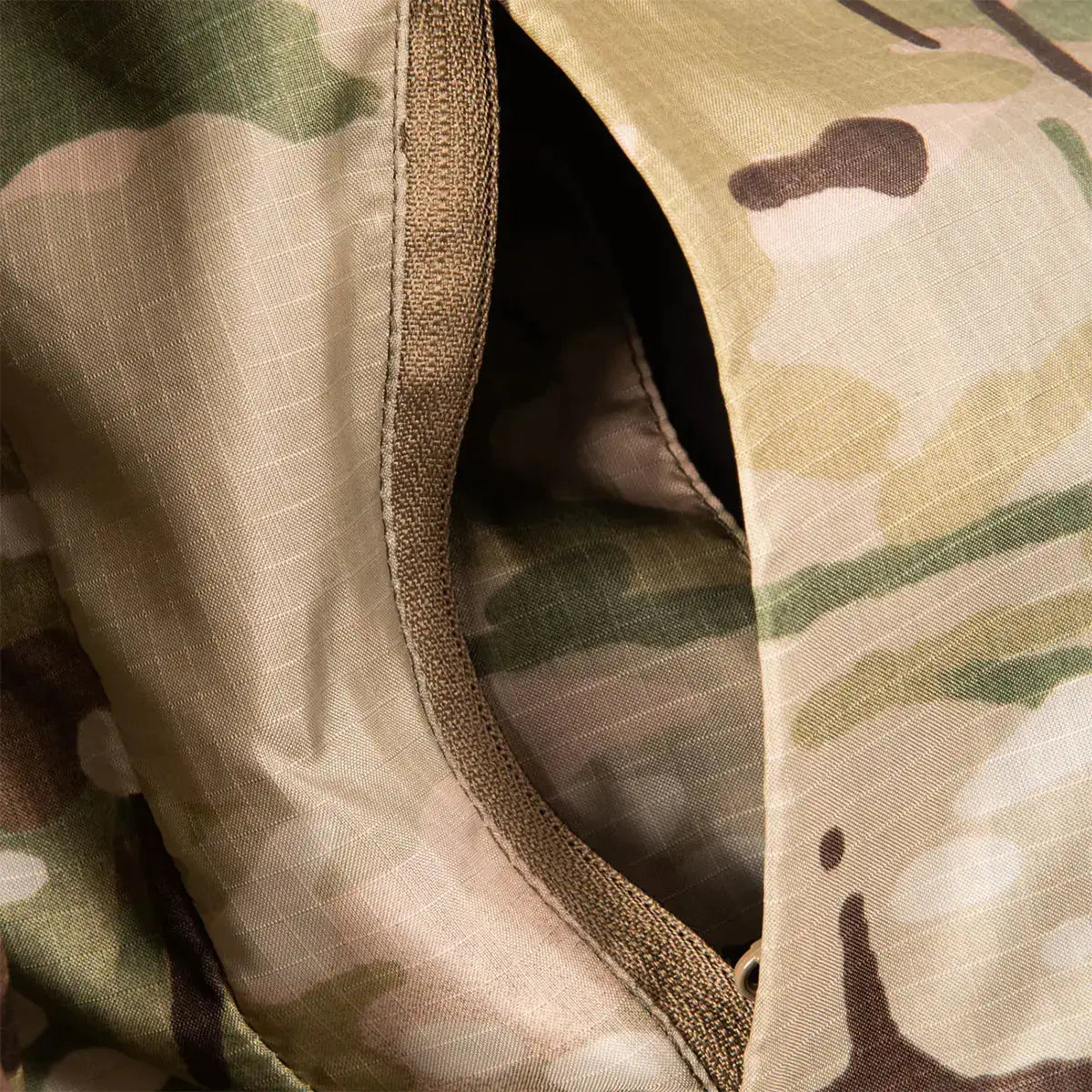 Close-up of zippered pocket on Snugpak Spearhead Midweight Insulated Jacket WGTE Multicam, designed for secure gear storage. from John Bull Clothing